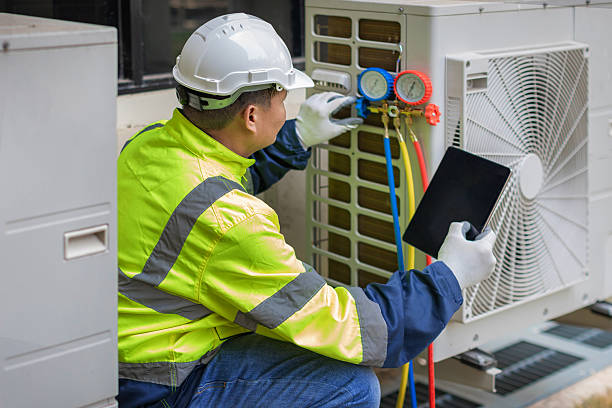 Professional Heat Pump Repair technician working in Holmesville, OH